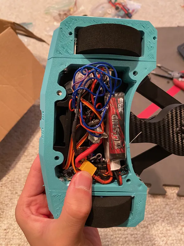 Plate off: LiPo, ESCs and wiring packed between the two wheels