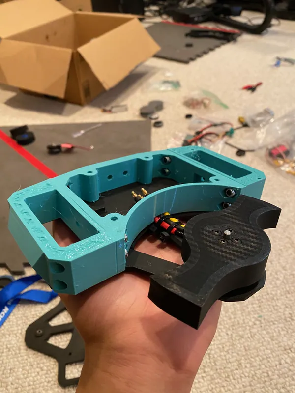First test fit of the TPU frame on a plate, with the two-tooth blade