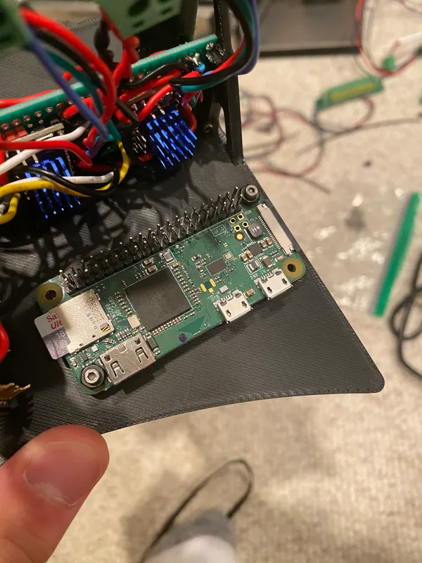 The Raspberry Pi Zero 2 W on the left bay, with the driver board behind it