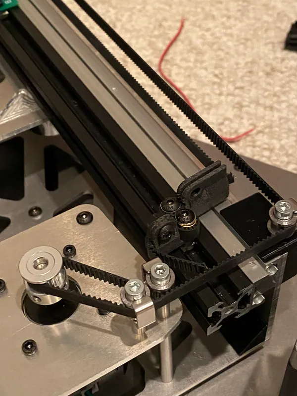 The belt, printed clamps and idlers at the motor end (July 2024)