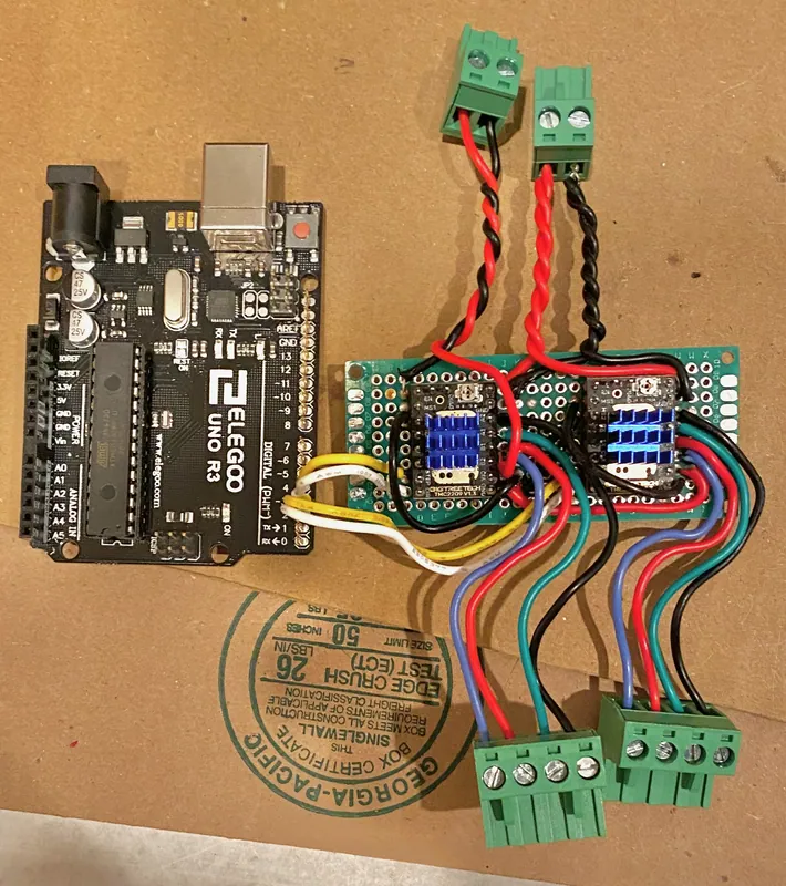 My perfboard: two TMC2209 drivers with pluggable motor terminals, next to the Uno (June 2024)