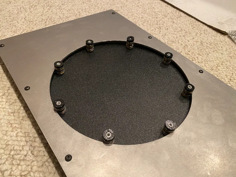The disc dropped into the middle plate, the bearings riding the edge of the hole