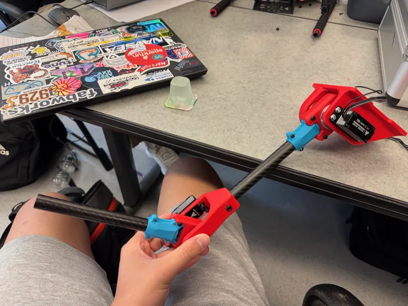 The arm assembled: shoulder mount and servo, the first carbon link, the elbow and the second link