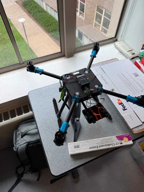 The X500 quadcopter on a desk in the lab