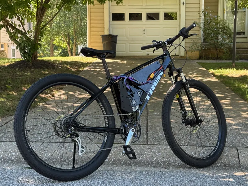 The finished bike, drive side: the drive unit in the front triangle, driving the bike's own chain