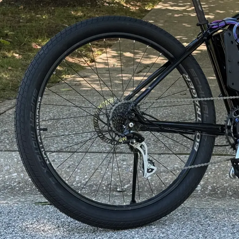 The rear wheel: the Schwalbe Super Moto-X tire and the cassette the chain drives
