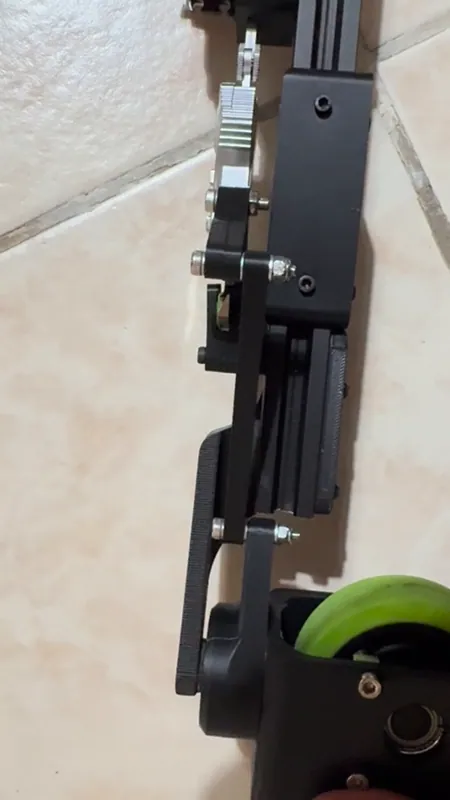 The front end from above: fork, bearing holder arm, link and caliper clamp