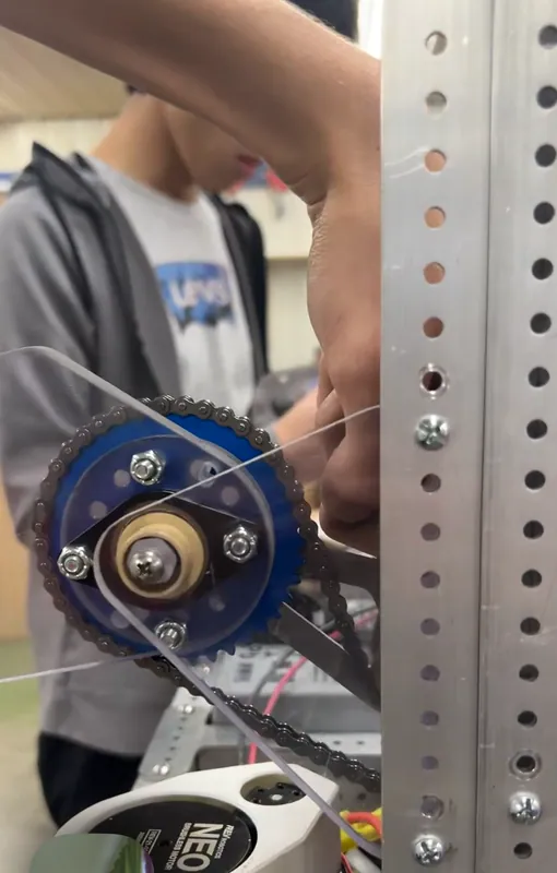 Mar 10, a screenshot from a video call with the shop: the intake pivot sprocket and its chain going on beside an upright