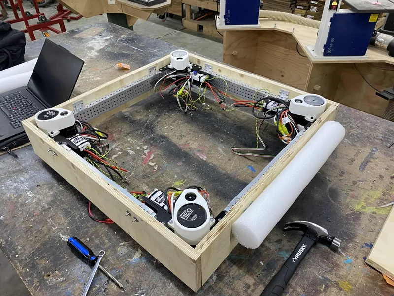 Feb 7: the four swerve modules wired up on a wooden test frame