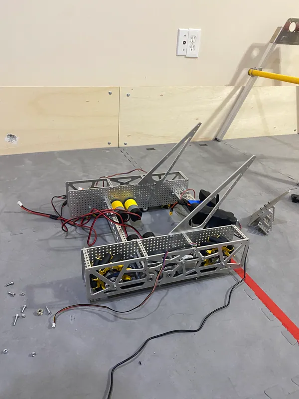 Dec 12, 2023, four days before the first qualifier: the chassis wired on the floor