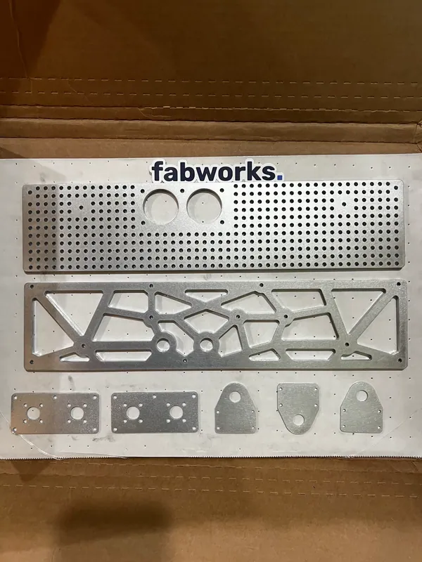 Nov 18, 2023: laser-cut parts from Fabworks: a perforated plate, a lattice-cut side plate and small brackets