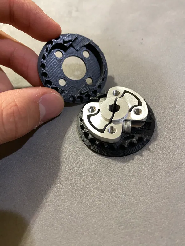 Jan 12, 2024: a printed pulley cracked beside its aluminum hub