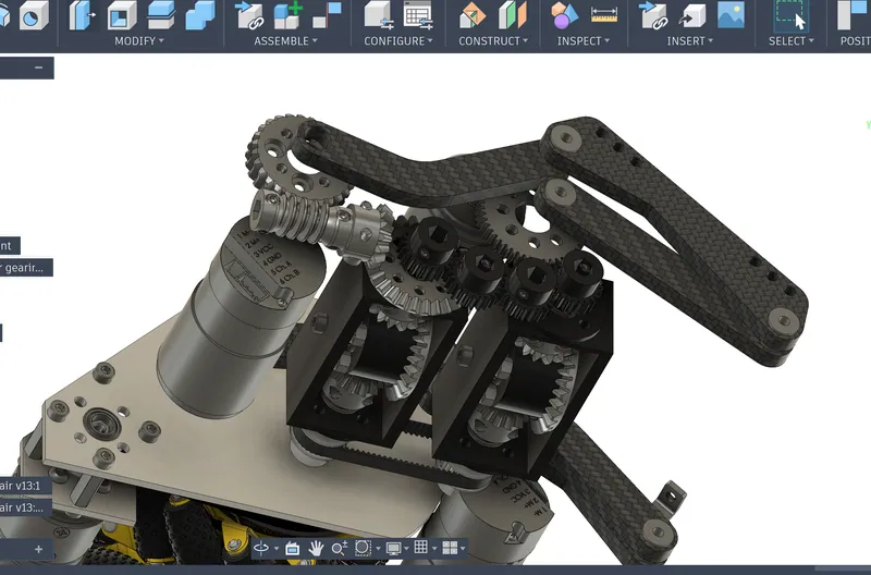 March 16, 2026: the carbon fiber 4-bar links on the worm wheel, the worm and its bevel gear, and the two differential housings open to show their bevel gears