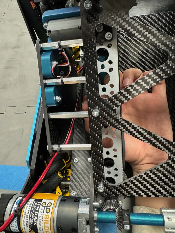 Reaching into the ramp past the X-cut carbon fiber inner plate: there is little room to spare between the plates