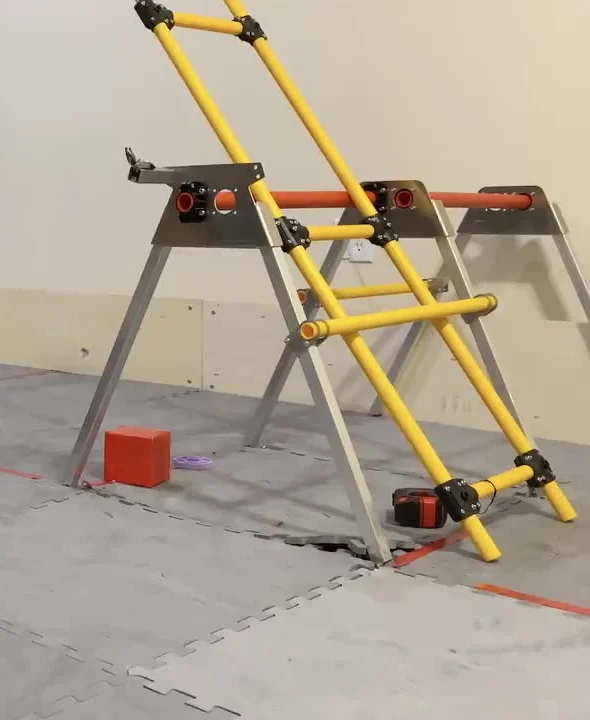 My team's CENTERSTAGE practice field: the trusses are the aluminum A-frames that hold up the rigging and the yellow stage door (a frame from a video of our robot)