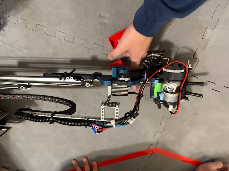 Feb 7, 2025, from above: the carriage, servo and cable carrier fit in one narrow strip, with that month's intake at the tip