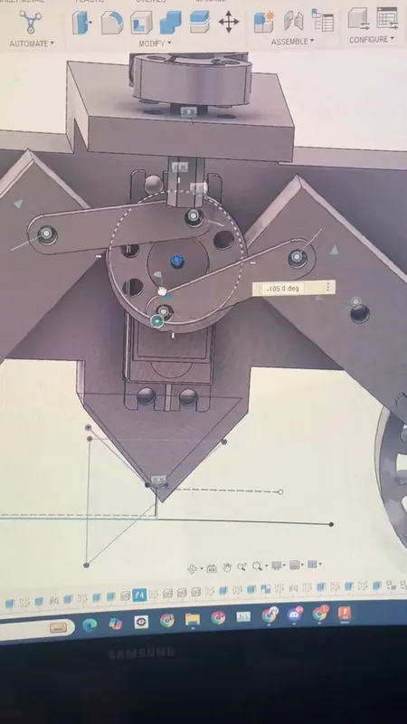 Version 5 in Fusion 360: a disc on the servo and two links that swing the wheel arms