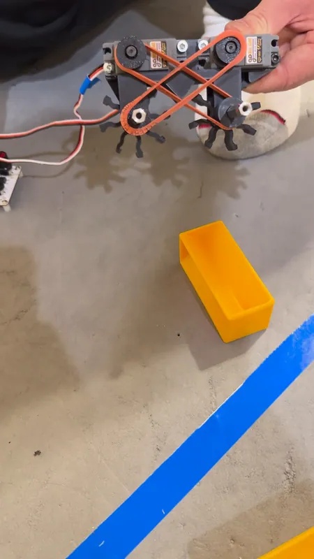 The same prototype from above: the O-ring belts cross between the wheels