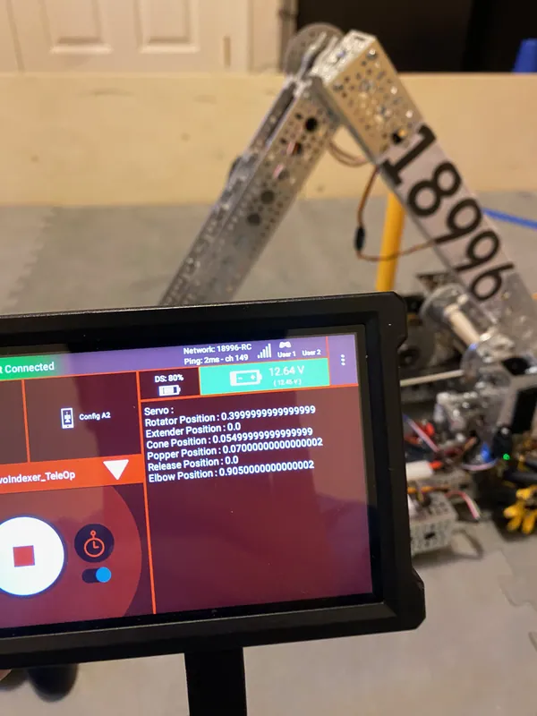 February 8: the Driver Hub held up in front of the arm, with the servo positions on screen
