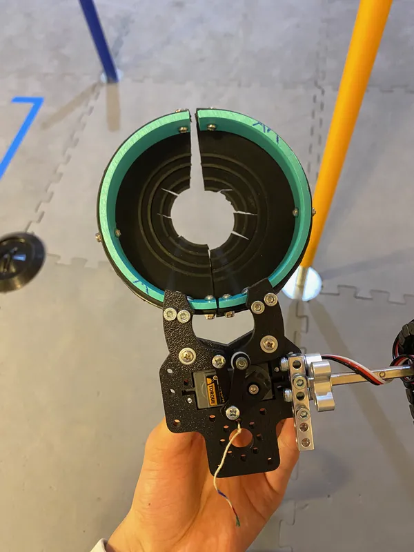 Feb 4, 2023: the split funnel closed, two black half-funnels with teal rims forming one ring