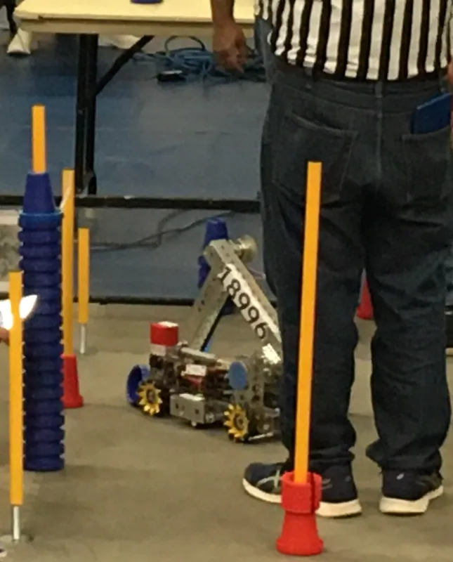 Right after qualification 38: a junction near our robot (18996 on the arm) holding a tall stack of blue cones