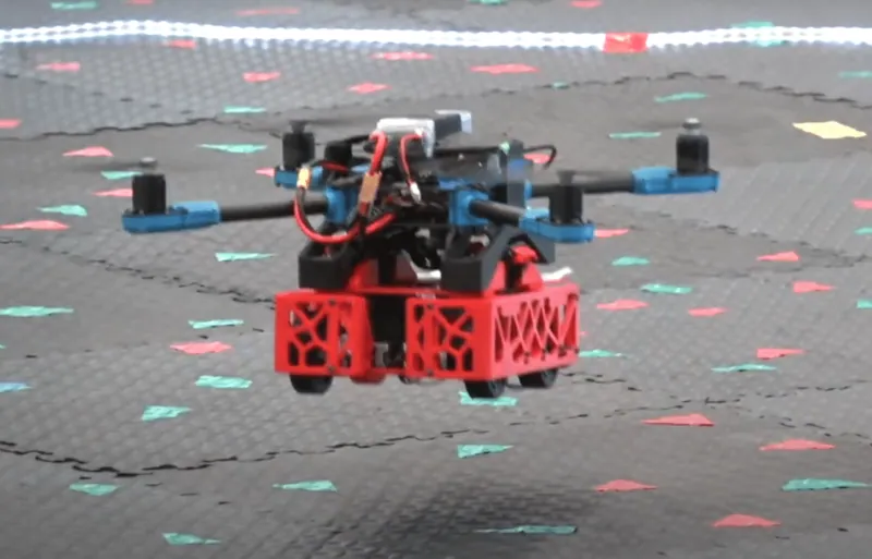 Docked and airborne: the drone carrying the rover in a low hover (Figure 1 of our poster)