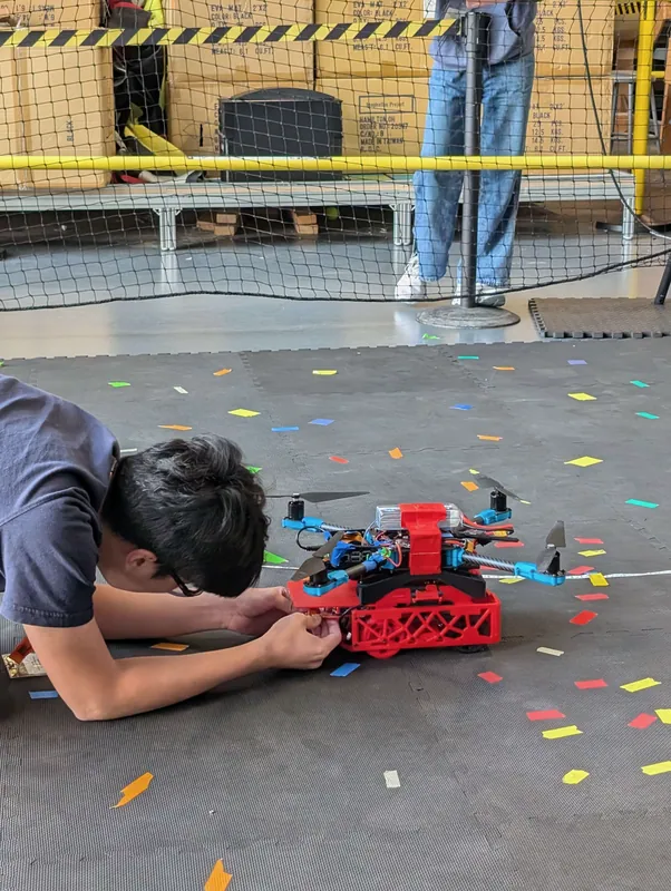 Aug 1: me connecting the ground rover to power in the flight cage