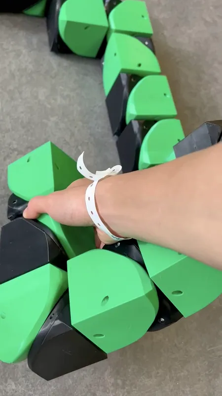 The printed cubes up close: a green half and a black half each