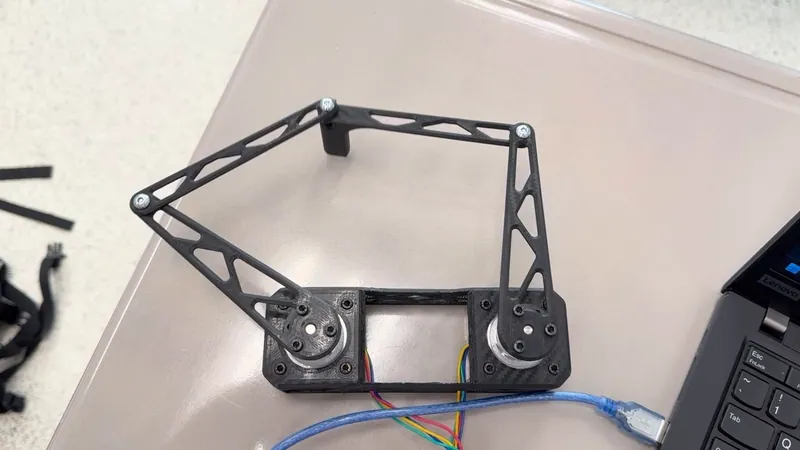From above: two motors, four links, five joints