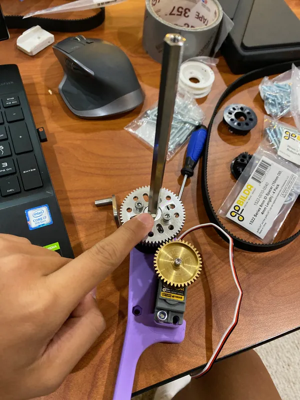 Aug 24, 2023: the arm servo with its pinion and the large aluminum gear, on a printed mount