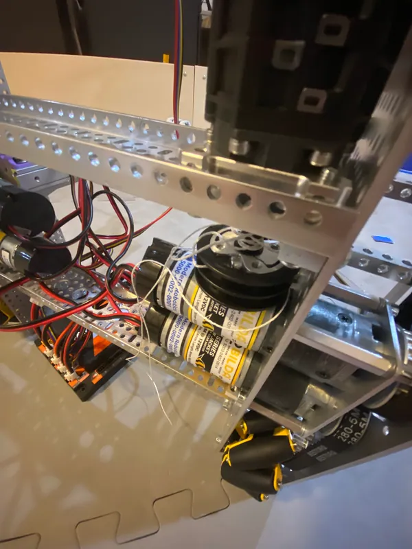Aug 23, 2023: a printed spool wound with string, on a motor with a gearbox of stacked planetary stages