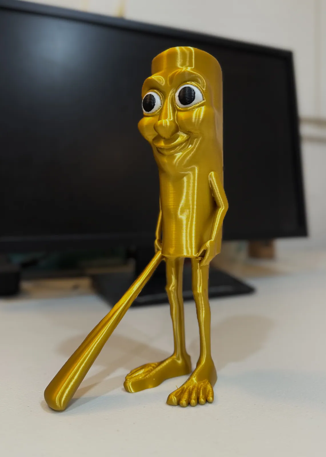 Triple T, printed in gold